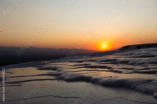 sunset view over white frozen hills