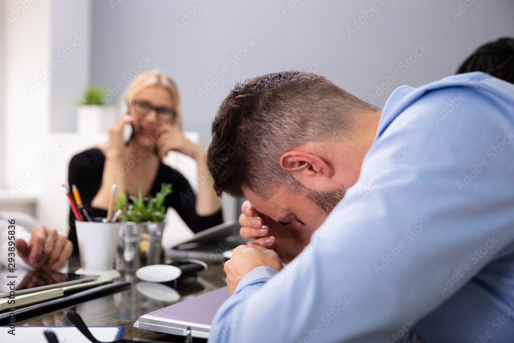 Businessman Getting Disturbed By Phone Calls Of His Partner Businessman Getting Disturbed By Phone Calls Of His Partner