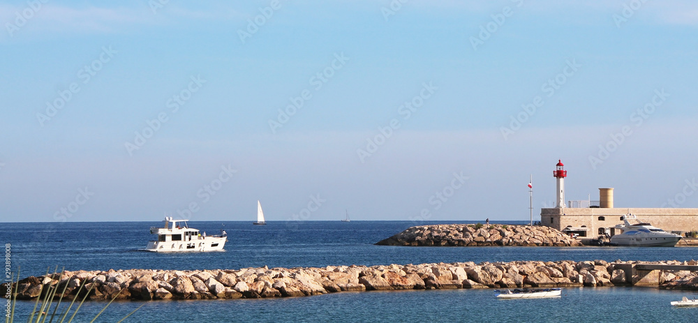 French Riviera - boat entering the port of Menton French Riviera - boat entering the port of Menton