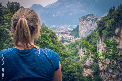 Climbing area, Massone, Arco, Italy. Climber - woman is looking to the valley.