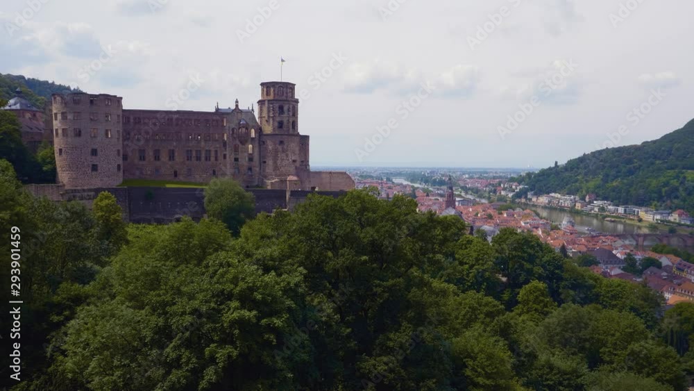 A view of Heidelberg castle over the Königstuhl hill in the Odenwald Mountains showing old city centre. A view of Heidelberg castle over the Königstuhl hill in the Odenwald Mountains showing old city centre.