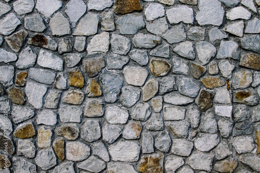 Beautiful stone wall made of rubble stone. Stone background. Beautiful stone wall made of rubble stone. Stone background.