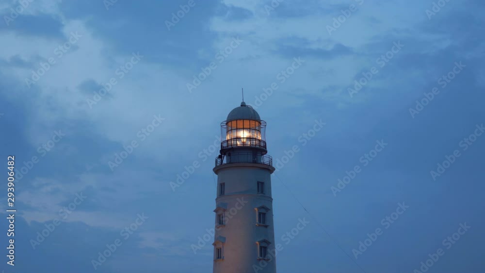 Picturesque white lighthouse at the dusk time. 4k footage. Picturesque white lighthouse at the dusk time. 4k footage.