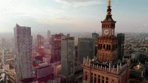 Aerial view of top of Palace of Culture and Science, Warsaw, Poland during the Sunset . CloseUp of clock photo