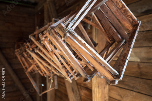 Wooden honeycomb frames hanging from the ceiling of an old log cabin in the Salzkammergut region, OÖ, Austria