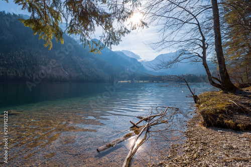 Scenic view of the great landscape reflecting on the shallow crystal clear water of the Vorderer Langbathsee near Ebensee, Oberösterreich, Austria photo