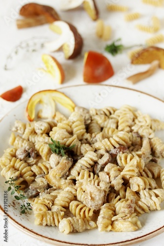 Fusilli paste with mushrooms Amanita Caesarea and boletus mushrooms and with cream. a family of fly-agarics of the highest category, a delicious mushroom. Italian Cuisine.