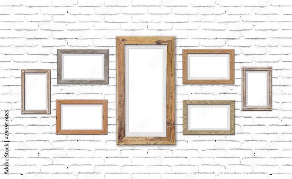 Collection of brown wood frames on brick wall. For interiors decor mockup Collection of brown wood frames on brick wall. For interiors decor mockup