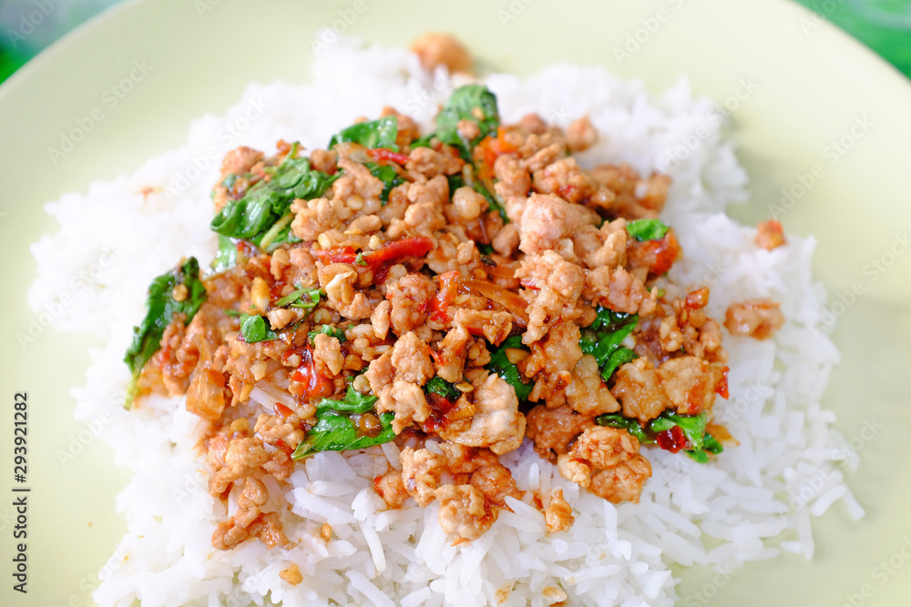 Rice topped with Minced pork and basil leaf. Traditional Thai street food. Rice topped with Minced pork and basil leaf. Traditional Thai street food.