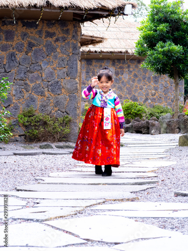 Asian little girl wearing a Korean Traditional Hanbok dress at Ancient village