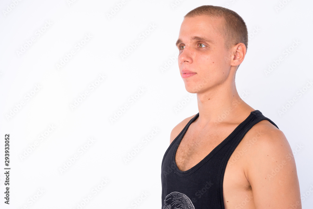 Face of young bald rebellious man thinking and looking up Face of young bald rebellious man thinking and looking up