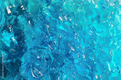 Blue cosmetic gel texture. Bright color jelly closeup background photo