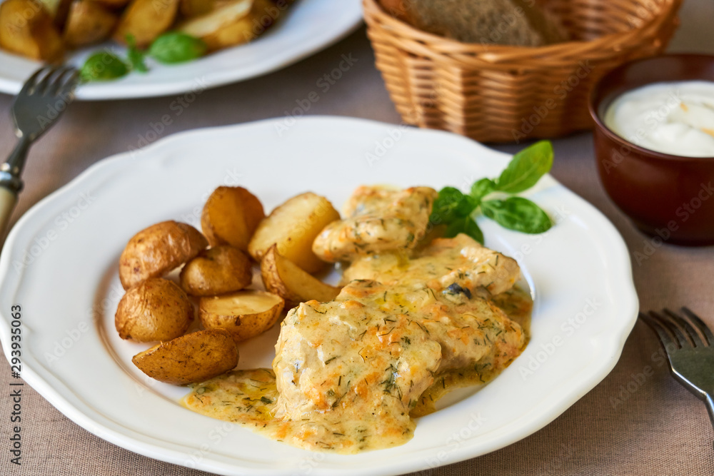 Stewed pork in creamy sauce with baked potatoes Stewed pork in creamy sauce with baked potatoes