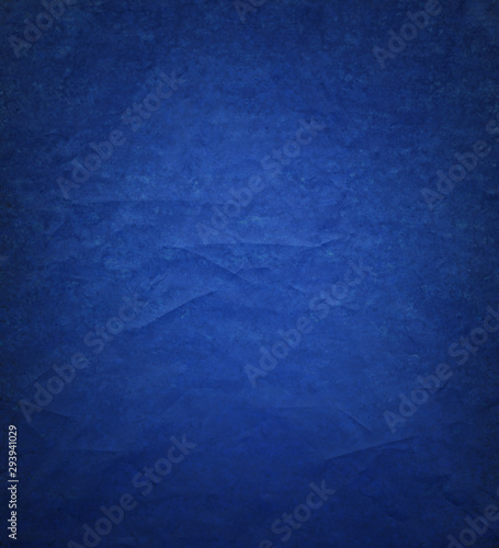 Blue background paper with ripped distressed old grunge texture in elegant vintage design
