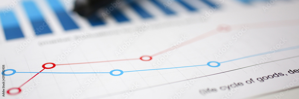 Financial statistics documents on magnifying glass lens office table closeup. Internal revenue service inspector sum check irs investigation exchange market earnings savings loan and credit concept Financial statistics documents on magnifying glass lens office table closeup. Internal revenue service inspector sum check irs investigation exchange market earnings savings loan and credit concept