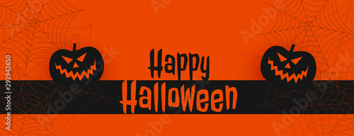 happy halloween orange banner with pumpkins and spiderweb