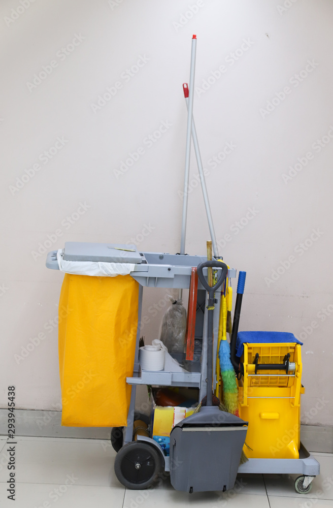 Closeup of janitorial, cleaning equipment and tools for floor cleaning. Vertical view. Closeup of janitorial, cleaning equipment and tools for floor cleaning. Vertical view.