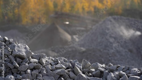 Industrial background - crusher stone crushing machine at the quarry of a mining and processing plant for crushed stone