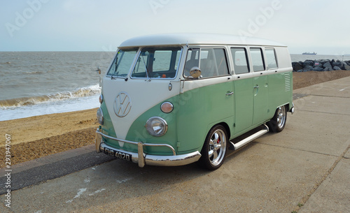 Valokuva Classic Green and white Camper Van parked on Seafront Promenade.