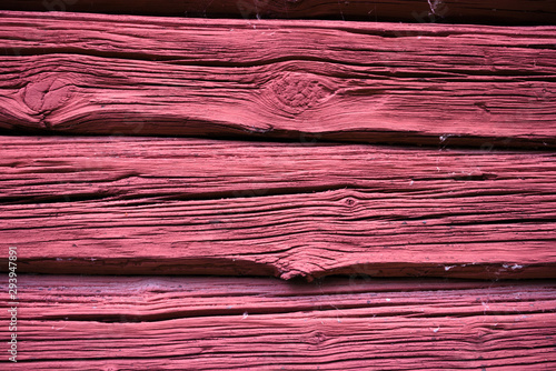 Old red planks on a Swedish barn close up for background