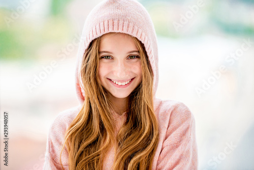 Teenage girl wearing hood photo