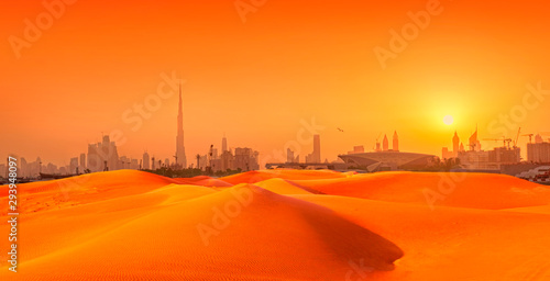 Dubai cityscape panorama with sand dunes at sunset. composite image of city and sand