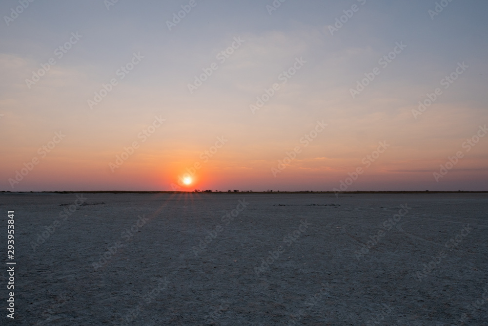 Sun Setting in Makgadikgadi Salt Pan - Empty Flat Plain and Horizon