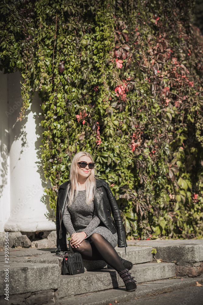 Happy woman of plus size, American or European appearance enjoying life. Young lady with excess weight, stylishly dressed at nature .Natural beauty Happy woman of plus size, American or European appearance enjoying life. Young lady with excess weight, stylishly dressed at nature .Natural beauty