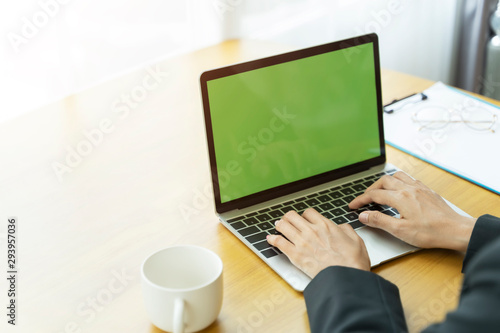 Closeup businesswoman hands using laptop in office. Business and technology concept.