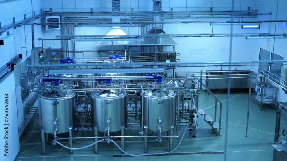 Industrial production of milk. Steel new pipelines and vats on milk factory Industrial production of milk. Steel new pipelines and vats on milk factory