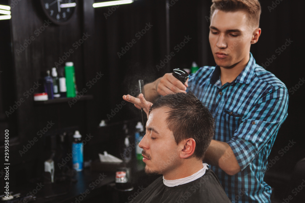 Mature man getting a new haircut at the barbershop Mature man getting a new haircut at the barbershop