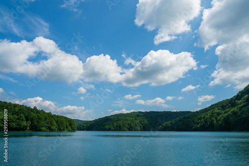 Scenic view of the azure coloured Lake Kozjak surrounded by densely wooded hills at Plitvice Lakes National Park in Croatia