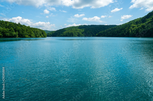 Scenic view of the azure coloured Lake Kozjak surrounded by densely wooded hills at Plitvice Lakes National Park in Croatia