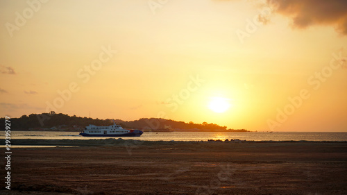 boat at beautiful golden sunset © PINANDIKA