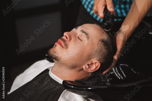 Mature man getting a new haircut at the barbershop © Ihor
