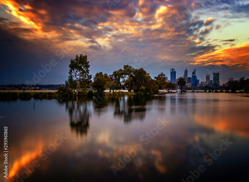 Mirror Image sunset cityscape, cloudy night © Sue