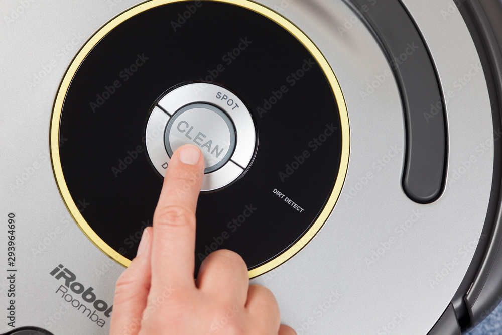 Limited shuffle Stor mængde Tambov, Russian Federation - January 26, 2014: iRobot Roomba 630 Vacuum  Cleaning Robot. Woman's finger pressing the button Clean to starting  cleaning. Studio shot. Stock Photo | Adobe Stock