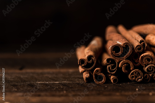 cinnamon sticks on wooden background