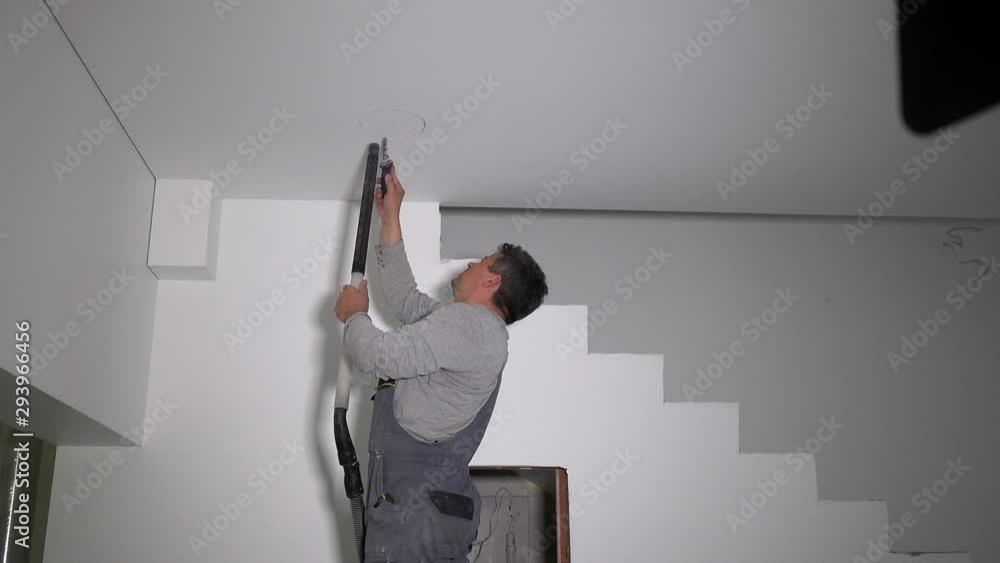 Handyman saw round hole in gypsum ceiling for led light panel Handyman saw round hole in gypsum ceiling for led light panel