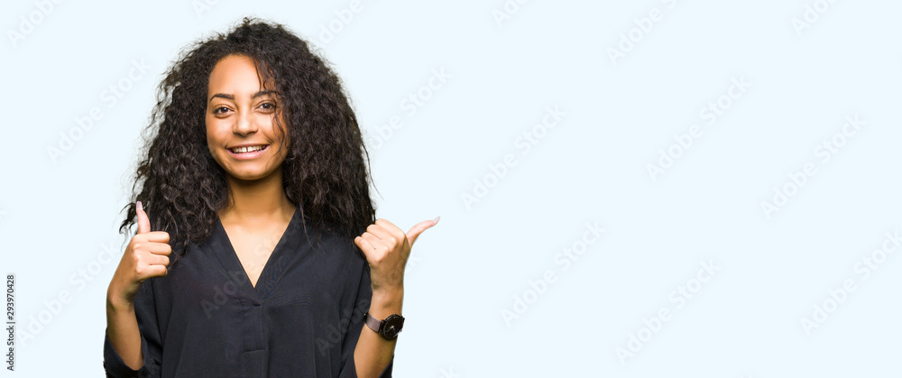Young beautiful girl with curly hair wearing elegant dress success sign doing positive gesture with hand, thumbs up smiling and happy. Looking at the camera with cheerful expression, winner gesture.