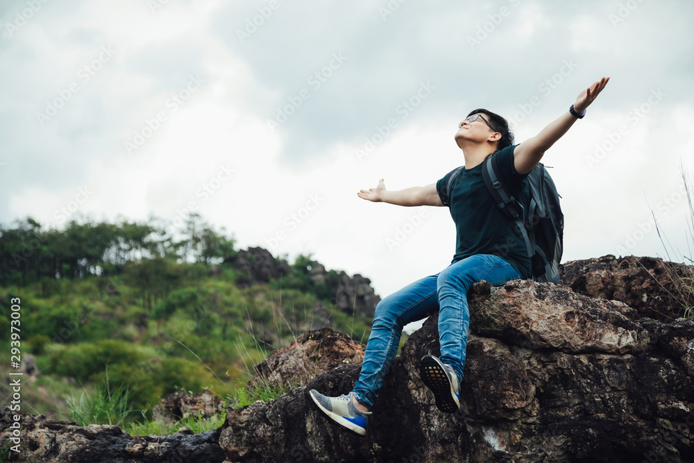 Traveler Man relaxing with view mountains landscape. Travel Lifestyle hiking concept summer vacations outdoor Traveler Man relaxing with view mountains landscape. Travel Lifestyle hiking concept summer vacations outdoor