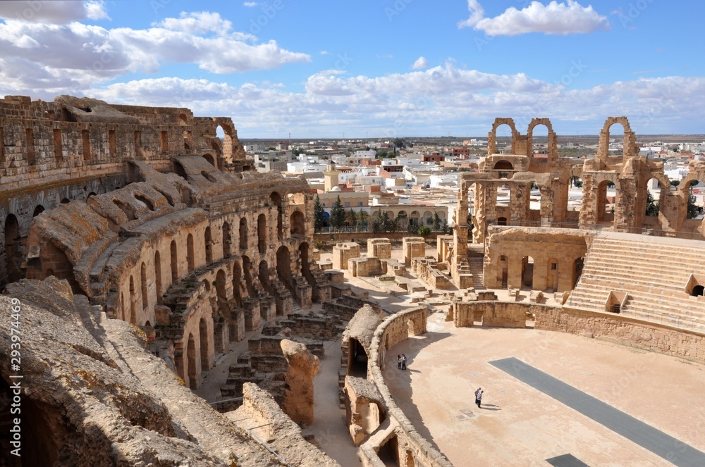 Amphitheatre of El Jem sunny weather with clouds. ruins of the Roman in the city of Tunisia