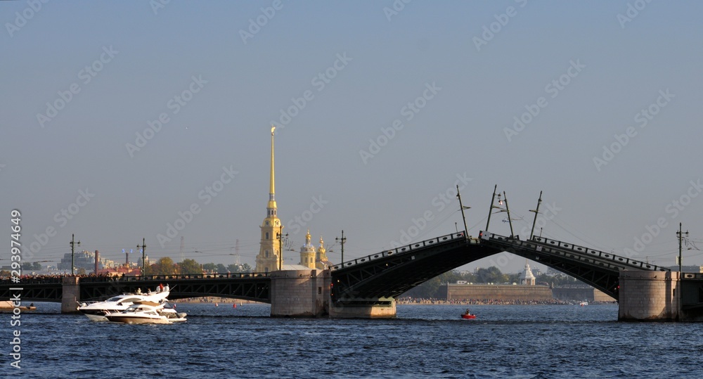motor boats near drawbridge in river Neva, Saint-Petersburg, Russia Peter-Pavel's Fortress