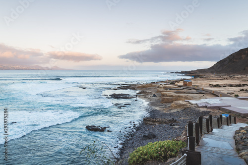 El confital beach at sunrise in Gran Canaria, Canary islands, Spain. Coast volcanic landscape. photo