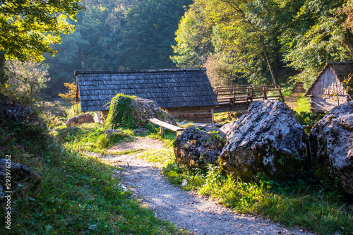 Small wooden houses by the river on popular picnic place Krupa na Vrbasu near the Banja Luka in Bosnia and Herzegovina photo