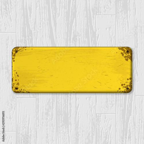 White laminate and parquet background with wooden texture and grunge yellow metal blank frame for text