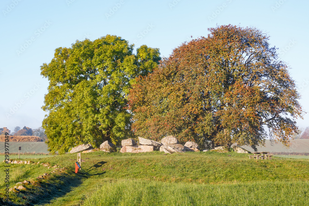 Prehistoric grave from the Stone Age a hill with trees Prehistoric grave from the Stone Age a hill with trees