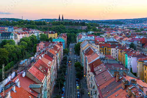 View of Prague taken from Nuselsky bridge (Nusle Bridge). Famous Vysehrad fort is behind it with Basilica of St. Peter and St. Paul. The Nusle Distric cityscape as seen from Vysehrad. Prague, Czechia.