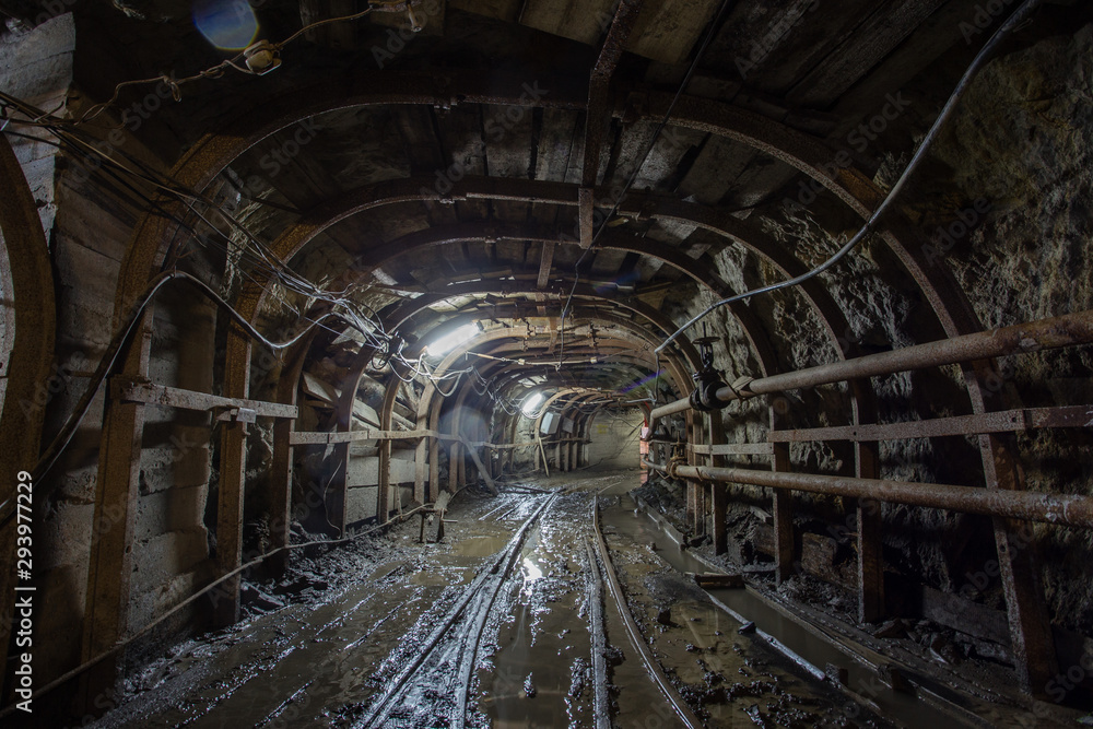 Gold mine ore shaft tunnel with rails