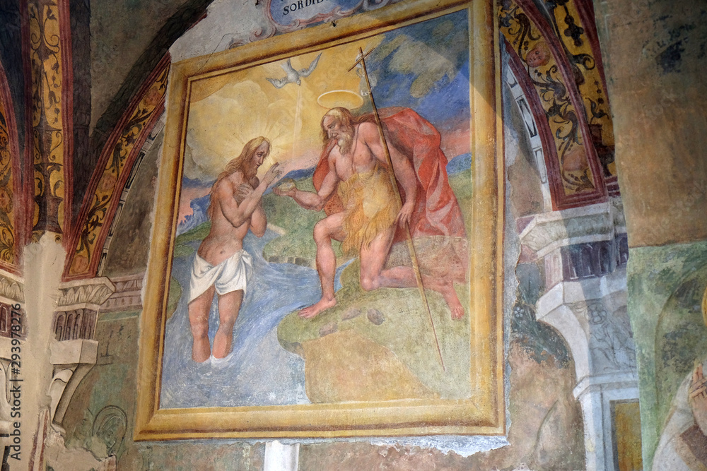 Baptism of the Lord, fresco in the church of St. Victor on the Fishermen Island, one of the famous Borromeo Islands of Lake Maggiore, Italy